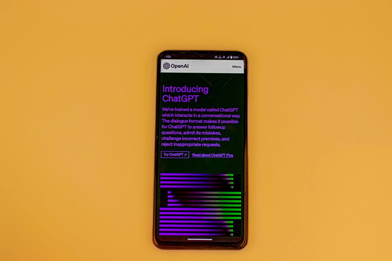 Smartphone displaying ChatGPT interface on a vibrant background, showcasing AI technology.